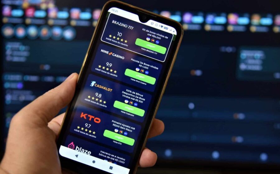 Smartphone exibindo aplicativo de apostas com símbolo de proibição, representando fim das bets no Brasil em 10 dias