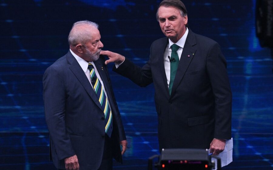 Lula discursa em comício na Praça Tancredo Neves, Florianópolis, sob chuva e tendas, ao lado de Gelson Merisio