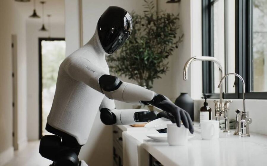 Robô humanoide da Tau Robotics limpando sala de estar residencial com aspirador