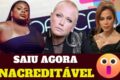 Dona Antônia José de Oliveira, 63 anos, sorri segurando seu álbum de estreia após vencer câncer