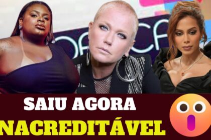 Dona Antônia José de Oliveira, 63 anos, sorri segurando seu álbum de estreia após vencer câncer