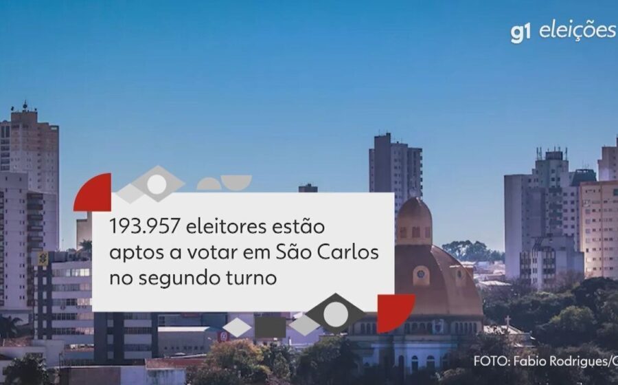 Eleitores na fila para votar no 2º turno das eleições 2026 em São Carlos, urna eletrônica em destaque