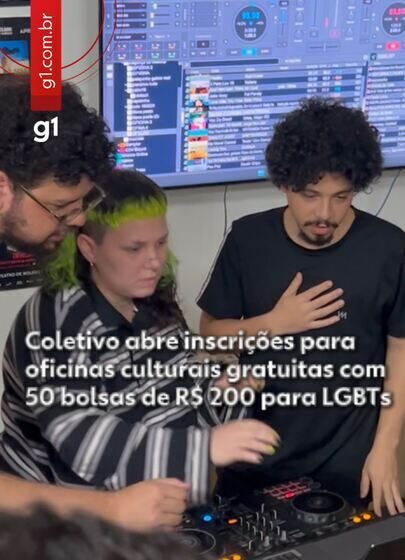 Grupo diverso de pessoas trans e não-binárias em atividade cultural do Coletivo 220 em São Carlos