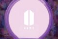 BTS se apresentando no Estádio Morumbis lotado com fãs brasileiros segurando lightsticks roxos