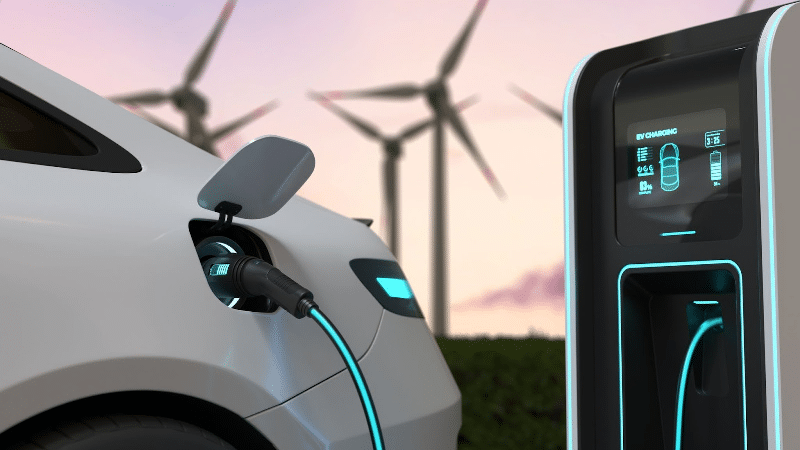 Fila de carros elétricos carregando em estação urbana moderna, símbolo da mobilidade sustentável em expansão