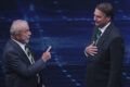 Lula e Flávio Bolsonaro em debate final na TV Globo mediado por César Tralli