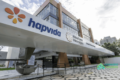 Prédio hospitalar da Hapvida com logotipo, representando operação sale-leaseback de R$ 1,5 bi