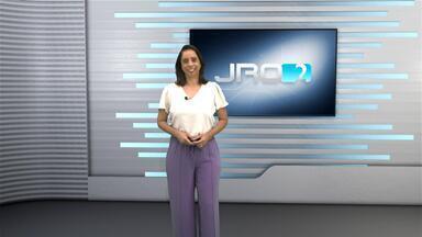 Logotipo do JRO2 com data 30 de agosto e apresentadores no estúdio da Record TV