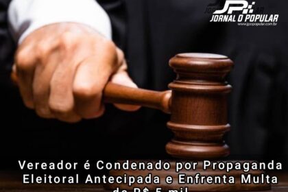 Manifestantes com faixas protestando contra demissões políticas em frente a fábrica de jeans