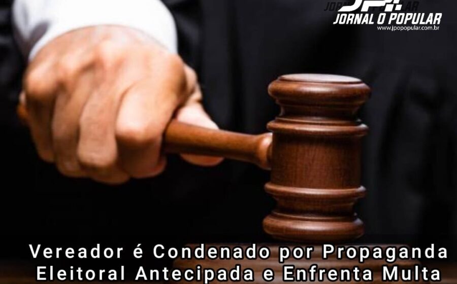 Manifestantes com faixas protestando contra demissões políticas em frente a fábrica de jeans