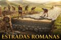 Antiga estrada romana pavimentada em pedra serpenteando por paisagem montanhosa histórica