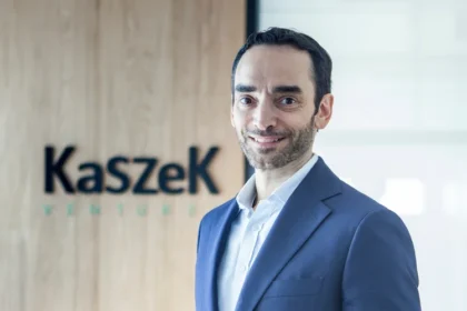 Hernán Kazah, cofundador do Kaszek, ao lado de gráficos mostrando investimentos em IA no Brasil