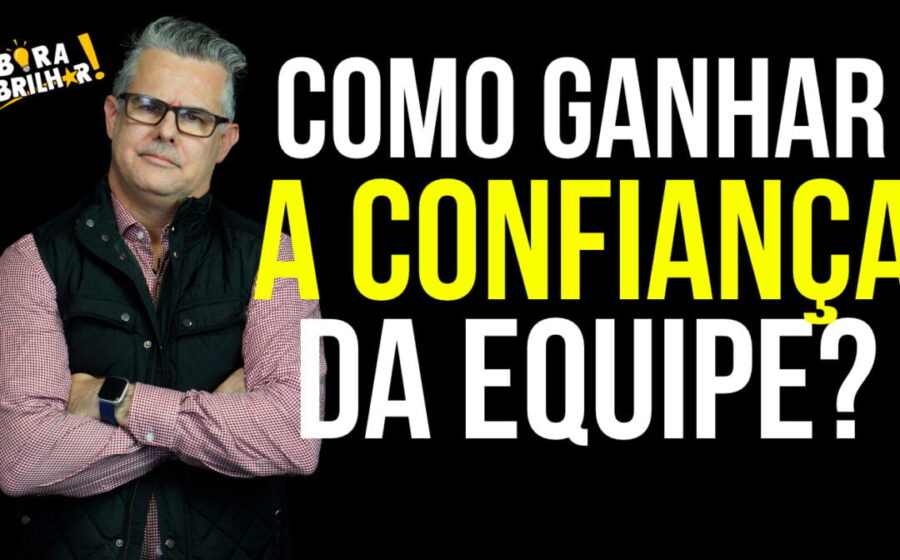 Executivo da ASML analisa gráfico de engajamento com equipe diversa ao fundo, símbolo de confiança