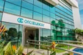 Sede da Oncoclínicas com gráfico de aprovação de 61% dos credores para reestruturação de R$ 5,7 bi
