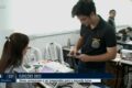 Eleitores na fila para votar no segundo turno em Petrolina, Pernambuco, urna eletrônica em destaque