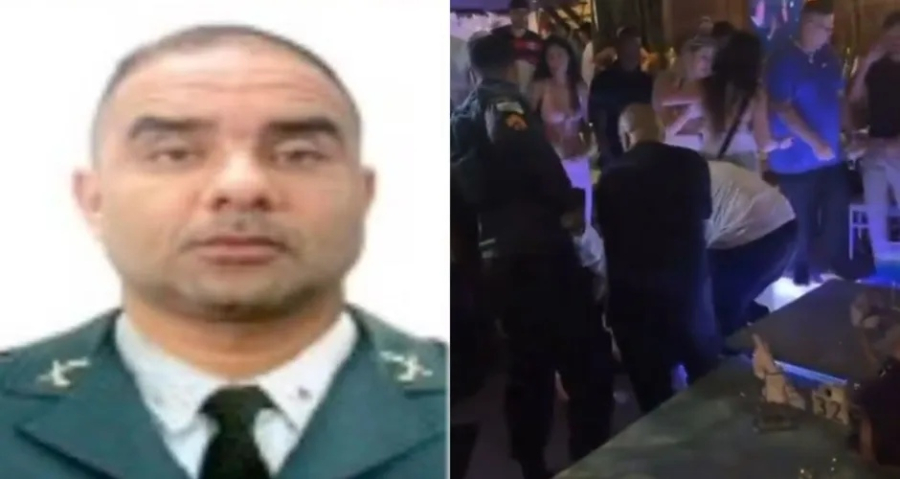 Sargento da PM em frente à pizzaria em João Pessoa com placa proibindo eleitores de esquerda