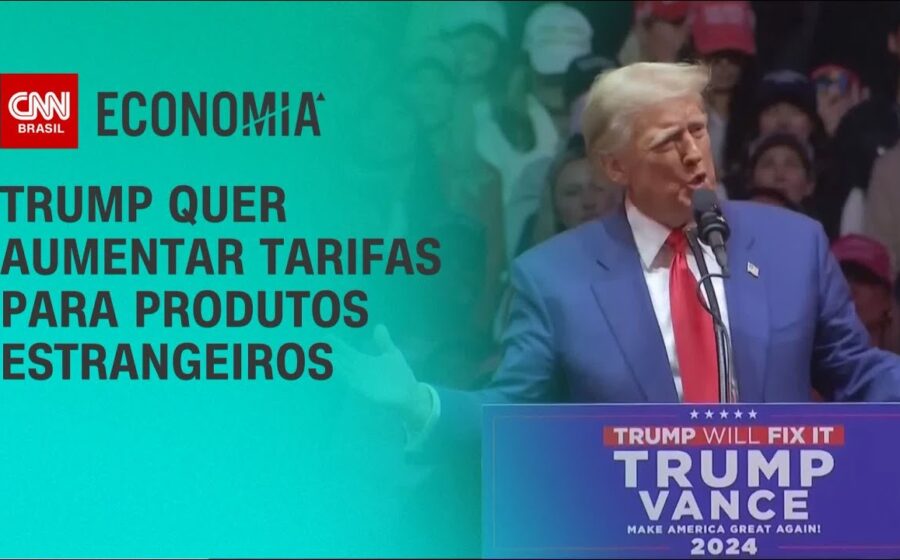 Donald Trump assinando documento com bandeiras dos EUA e Canadá, simbolizando fim de tarifas sobre produtos agrícolas canadenses